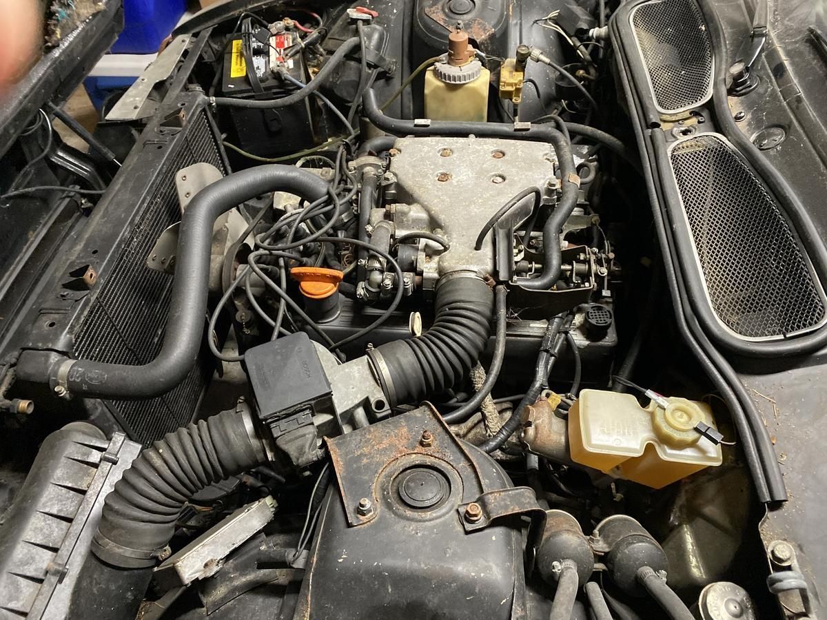 A close up of a car engine with a lot of wires