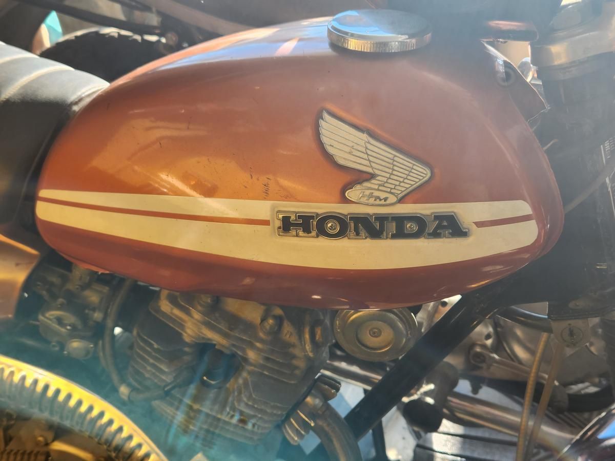 A honda motorcycle is parked in a garage