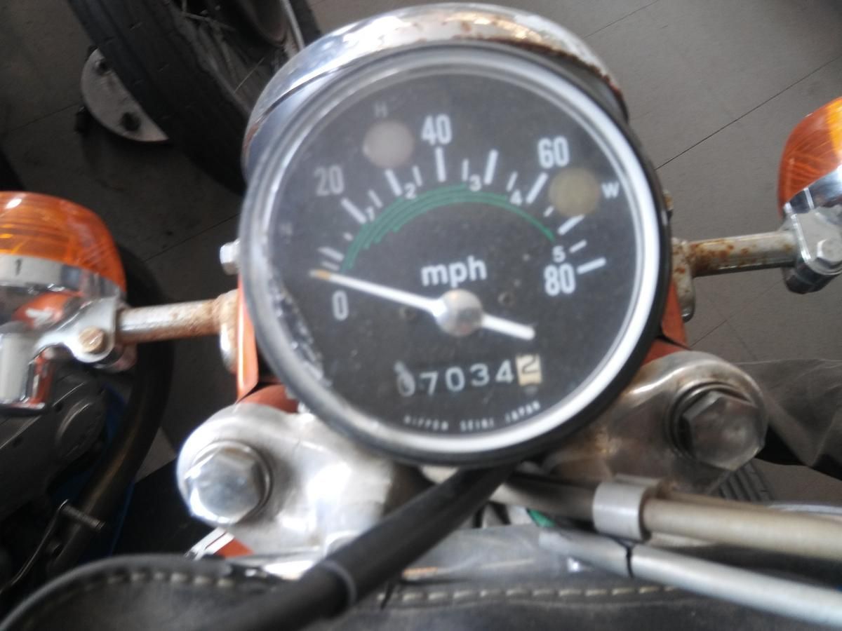 A close up of a speedometer on a motorcycle