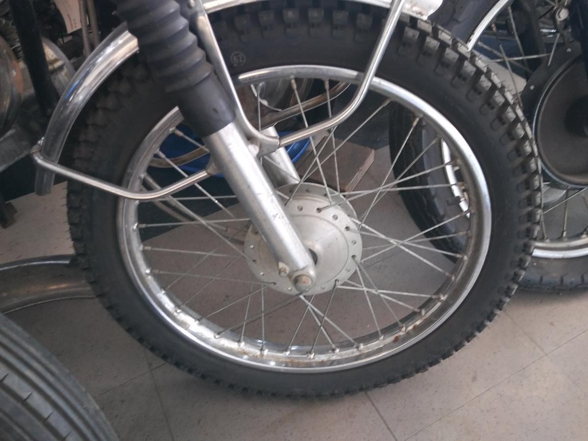 A close up of the front wheel of a motorcycle