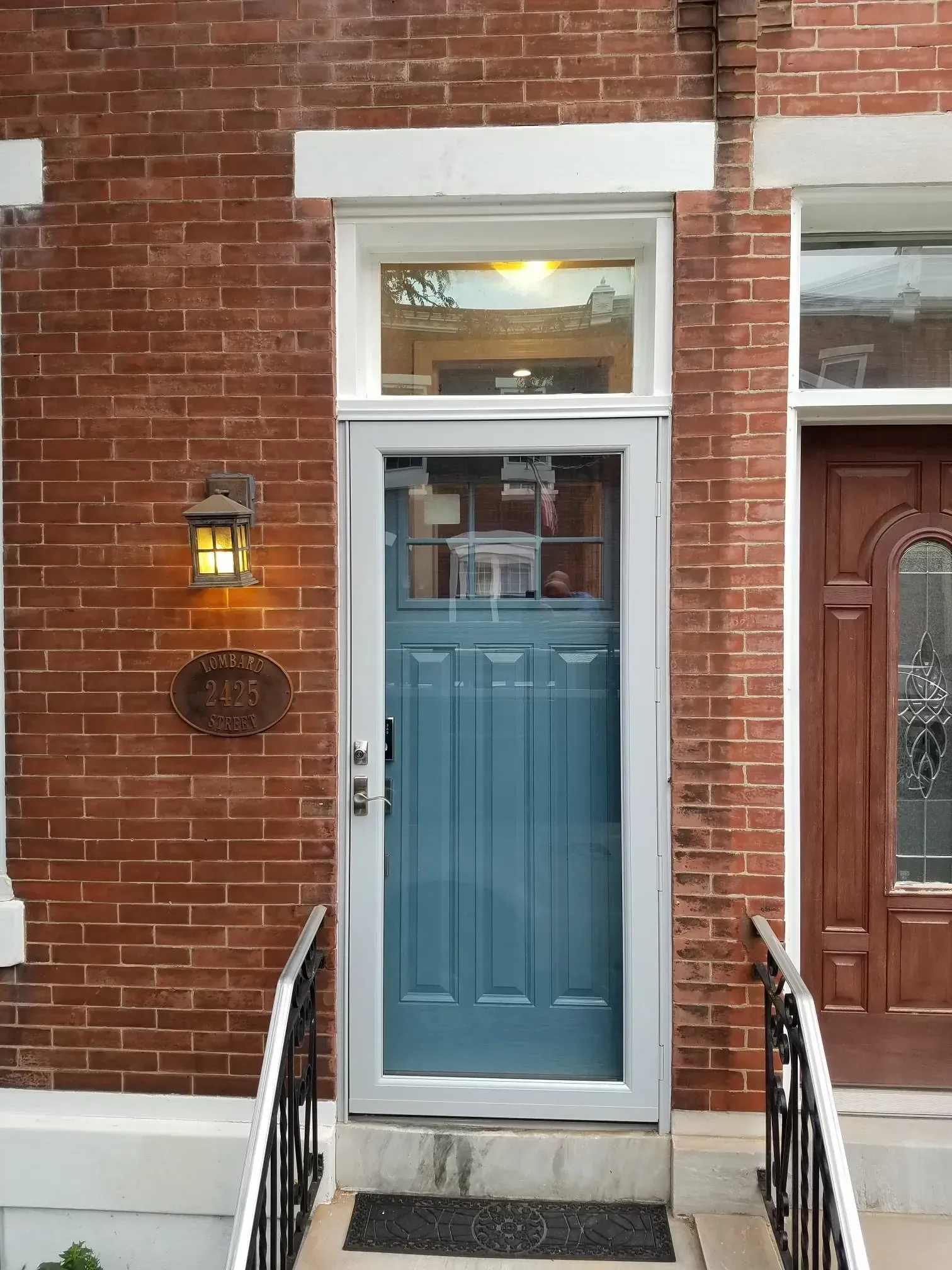 A Blue Door is on a Brick Building | Philadelphia, PA | First Choice Door and Window