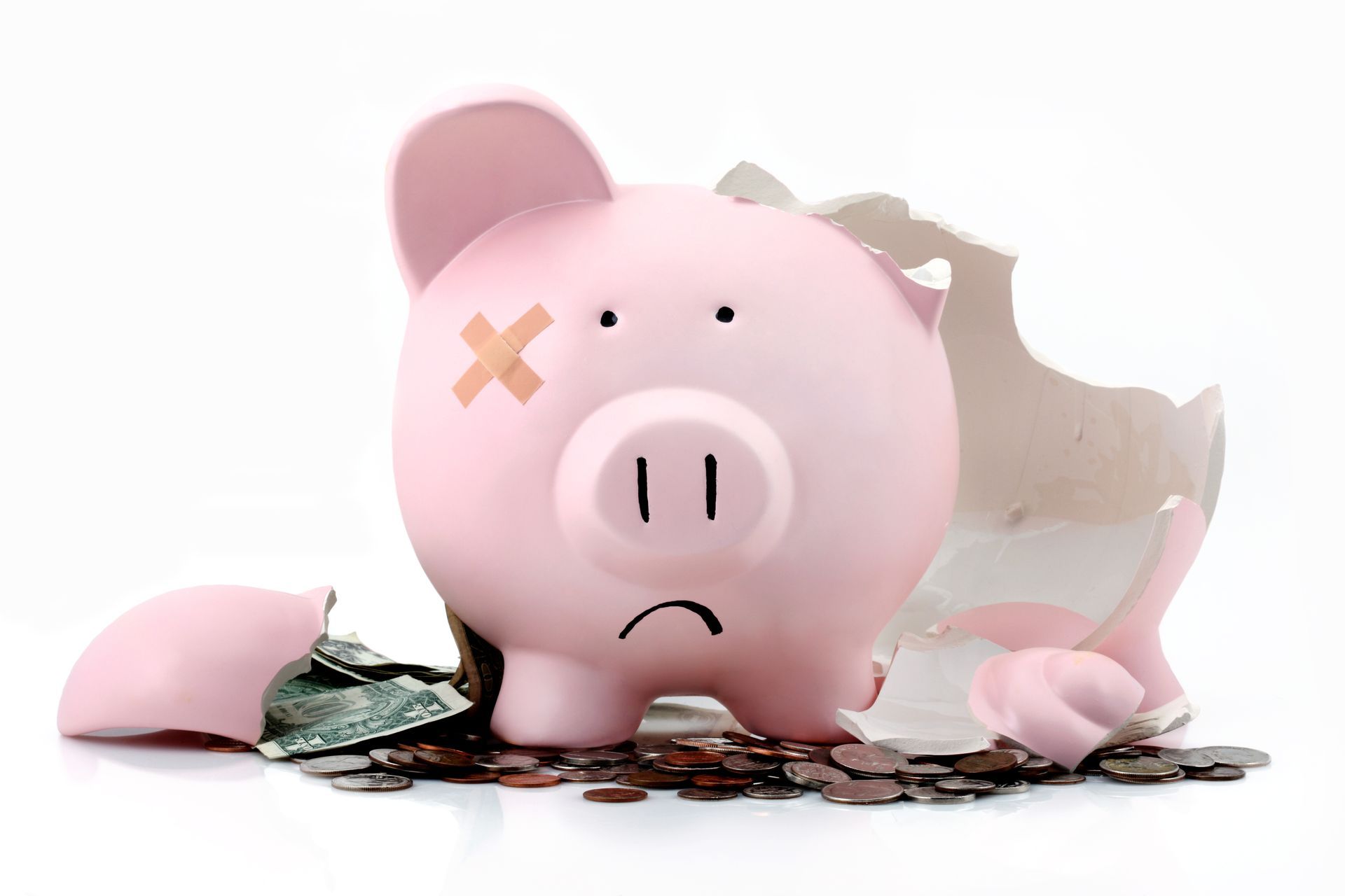 A broken piggy bank with a cross on its forehead