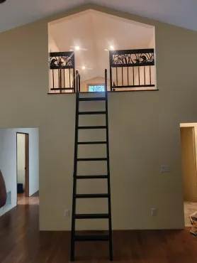 A ladder leading up to the second floor of a house