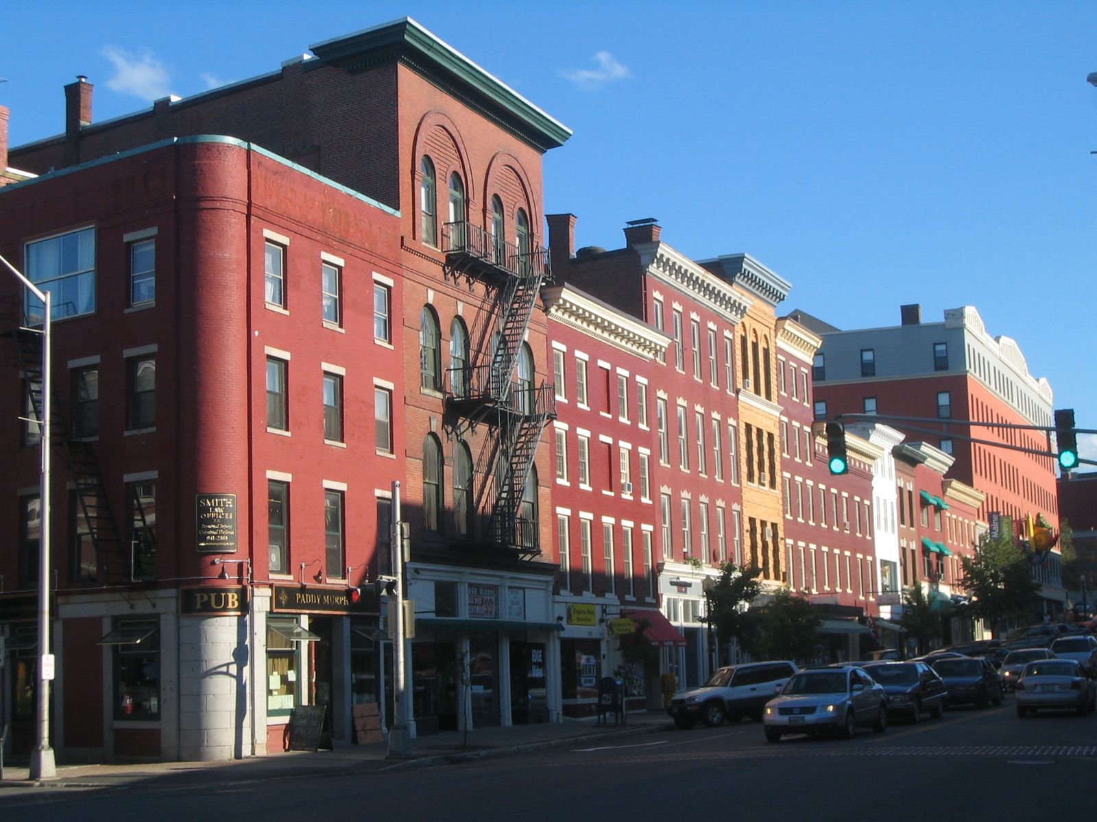 A row of buildings with one that says ' flex ' on it