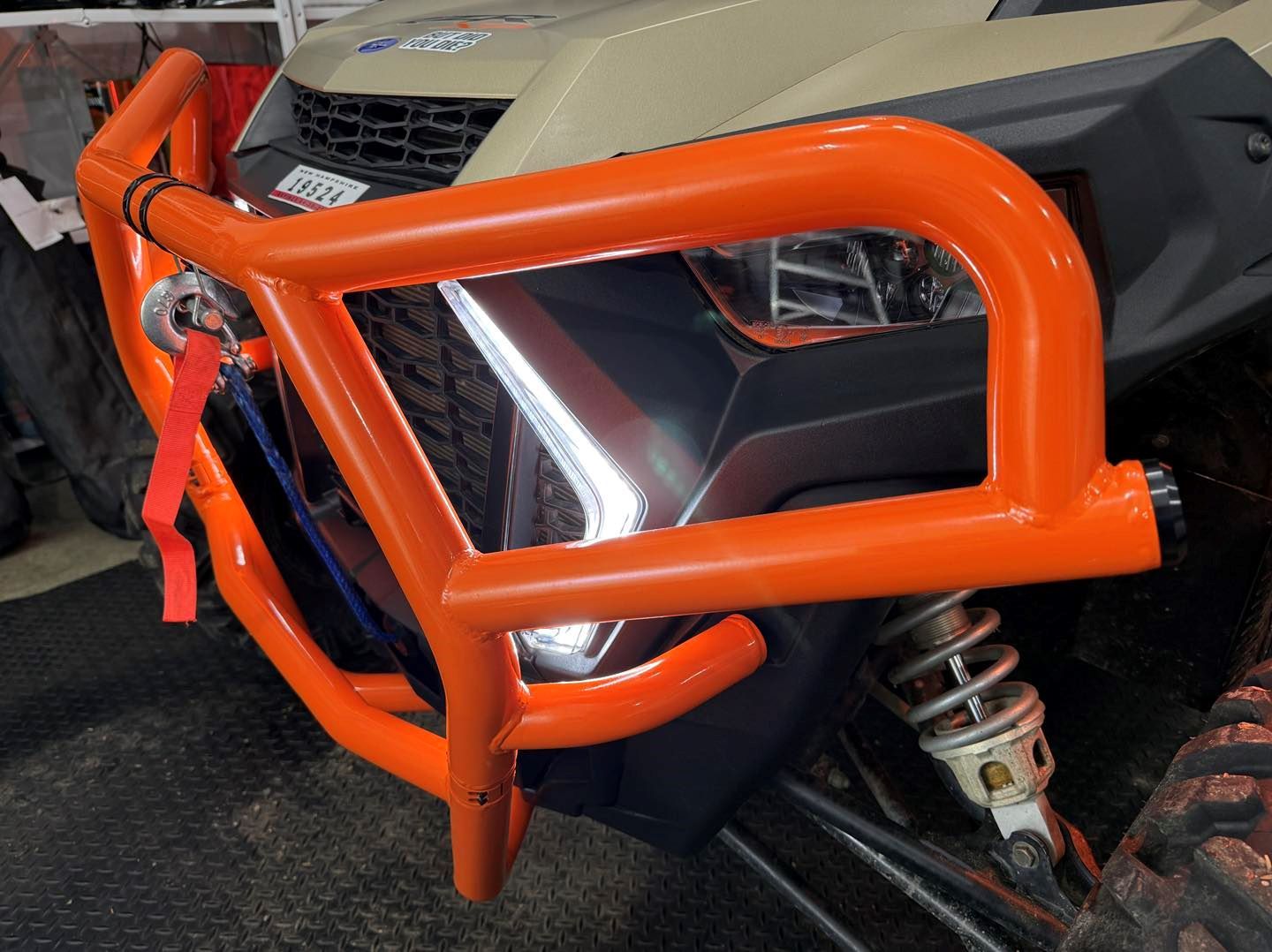 A close up of an orange bumper on a vehicle
