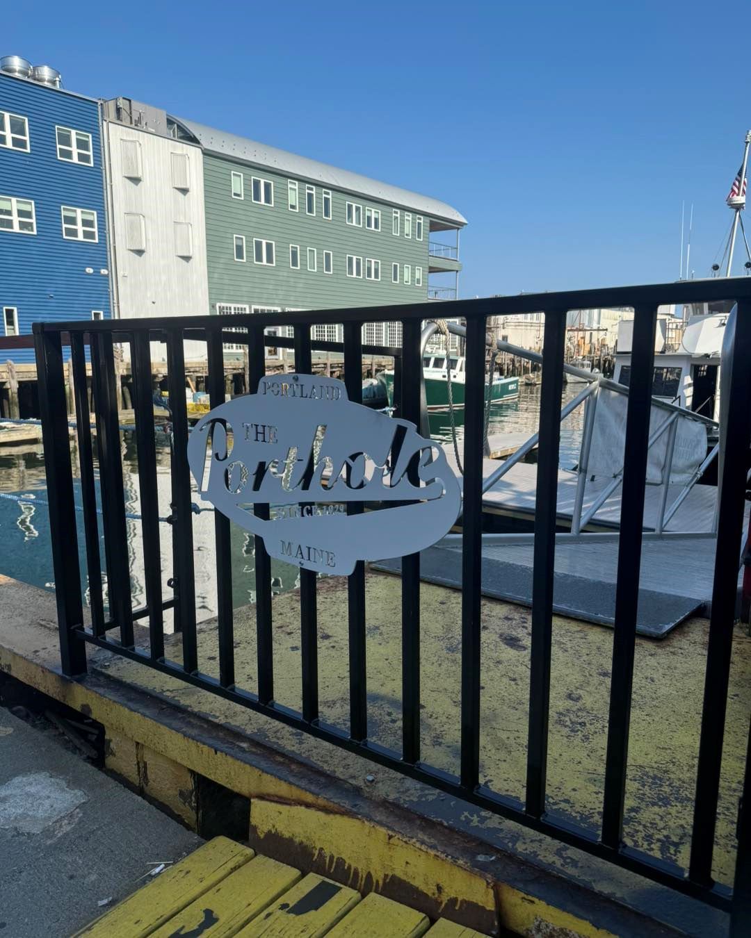 A fence with a sign on it that says portland