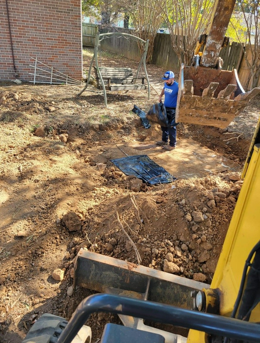 Residential Septic Service — Man Pumping Septic Tank in Decatur, AL