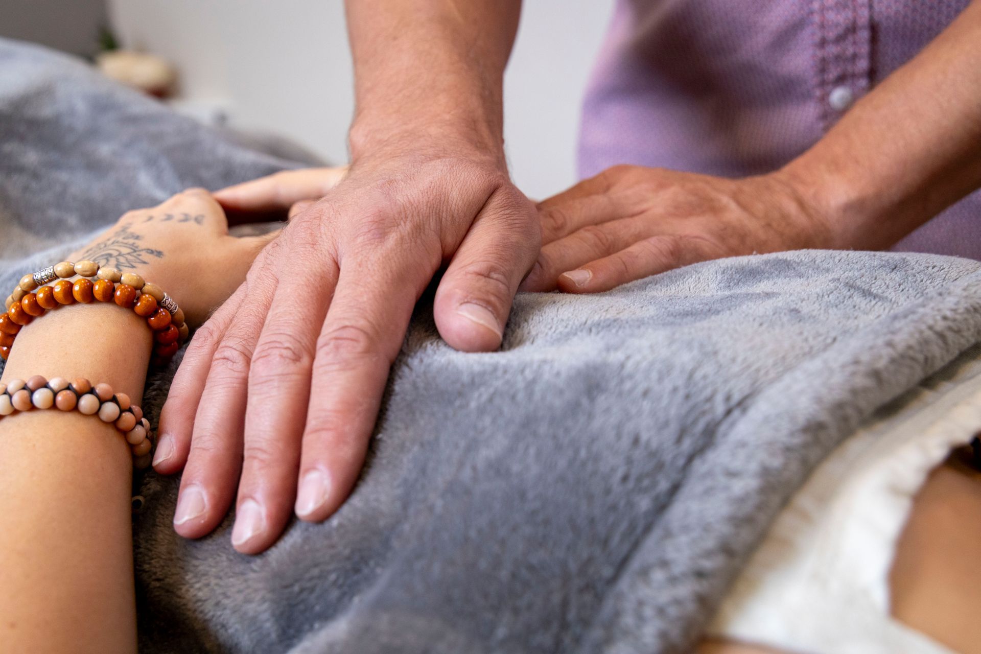 Woman receiving Reiki therapy