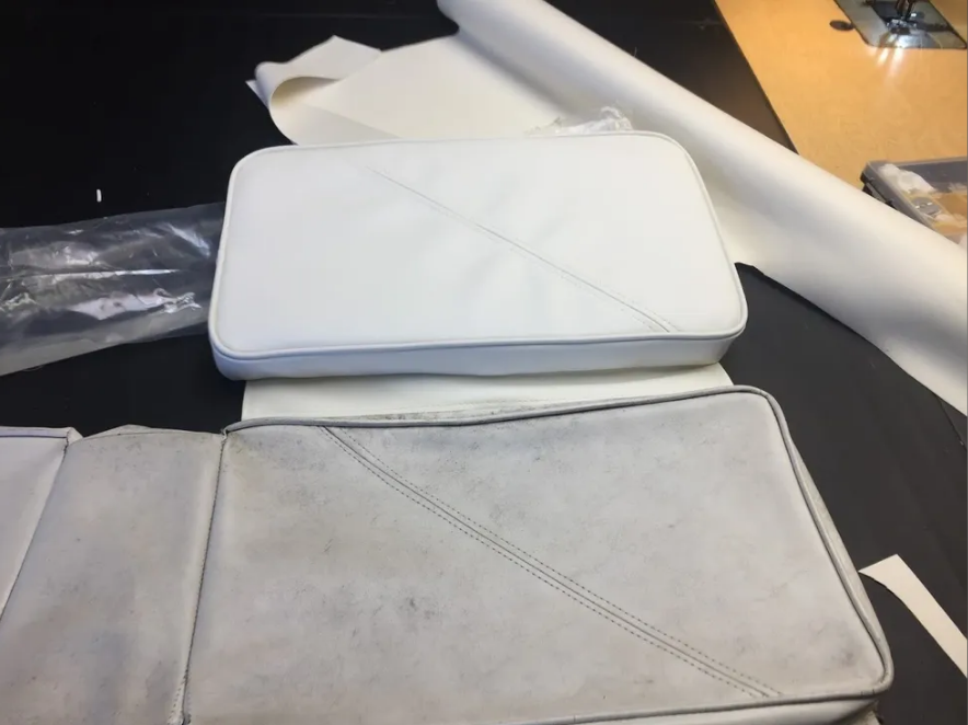 White and weathered boat cushions: new cushion on top of faded cushion.