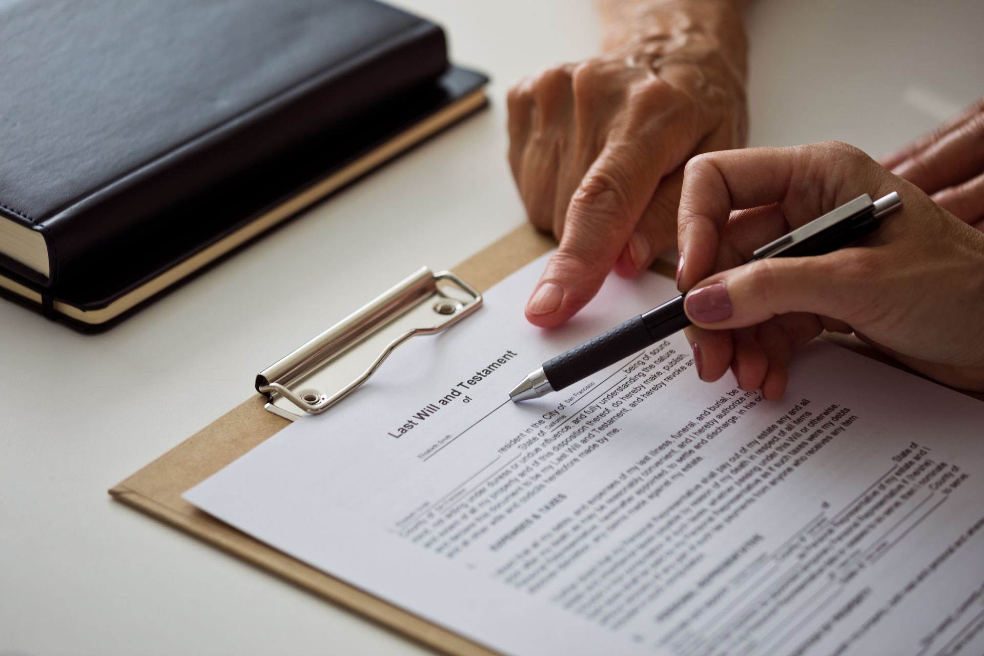 A female lawyer explaining the will to a senior woman.