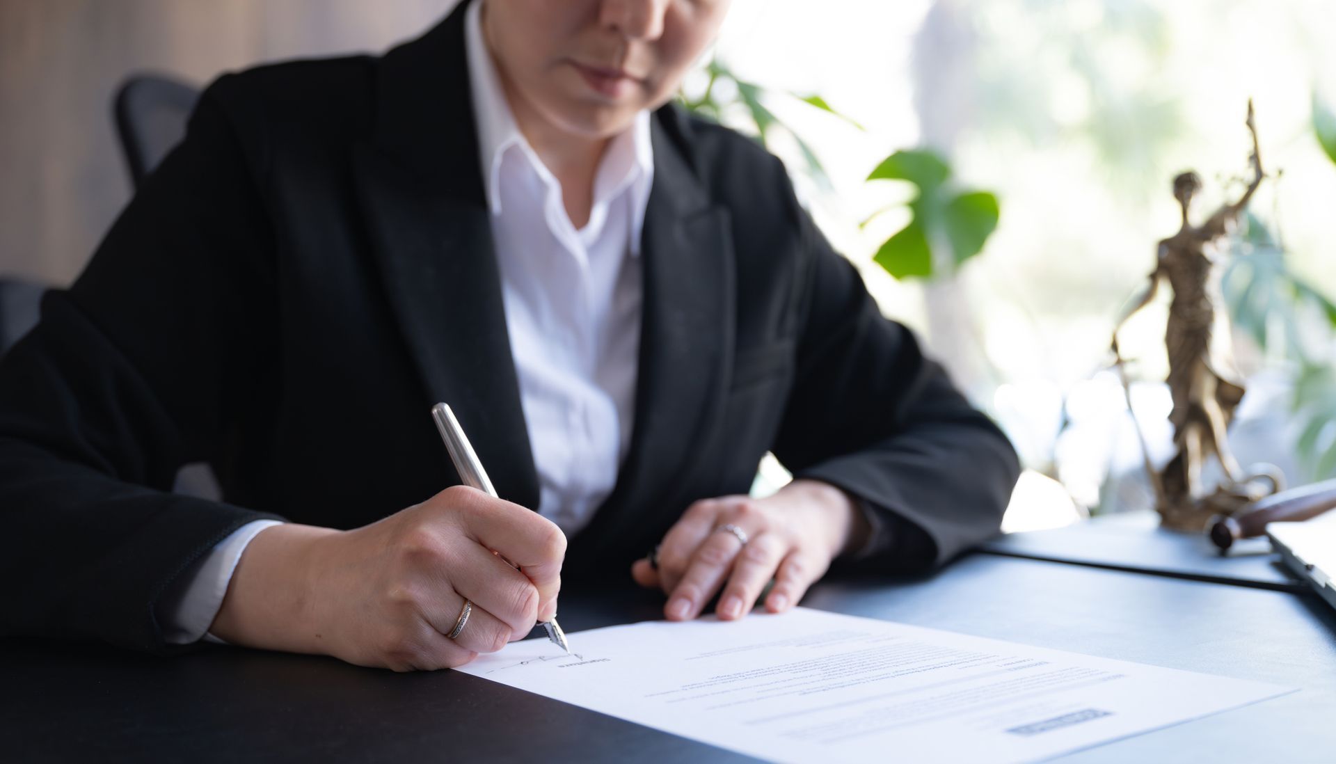 Estate and probate lawyer preparing important paperwork for a client.