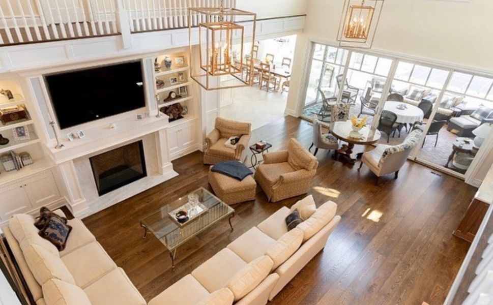 An aerial view of a living room filled with furniture and a fireplace