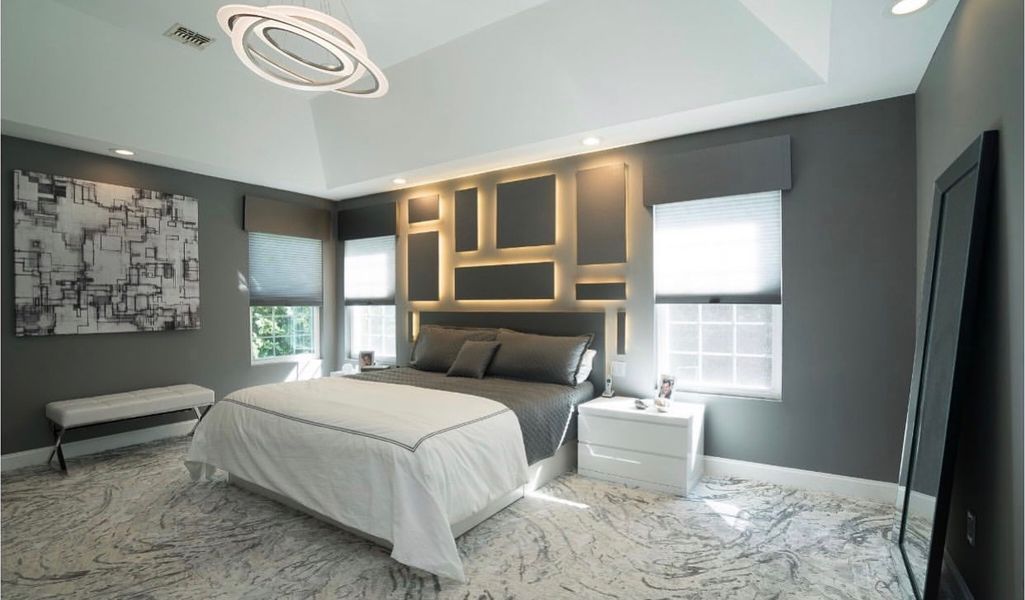 There is a large bed in the middle of the room