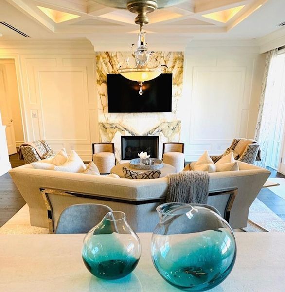 A living room with a couch and two vases on the table