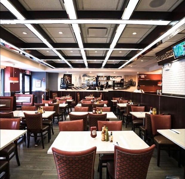 A restaurant with a lot of tables and chairs