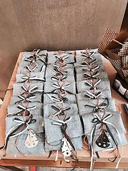 A bunch of bags sitting on top of a wooden table