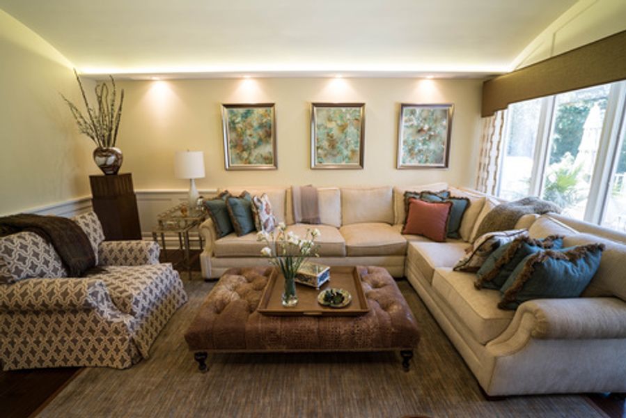 A living room filled with furniture and a coffee table