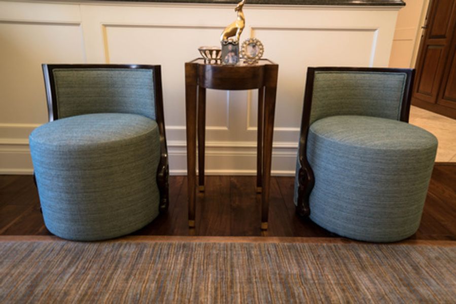 Two chairs and a small table in a living room
