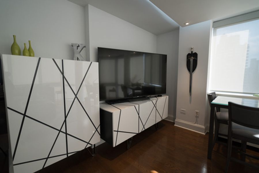 A living room with a large flat screen tv