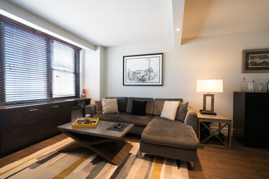 A living room with a couch and a coffee table