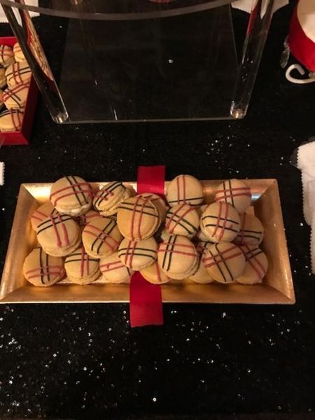 A tray of cookies on a table with a red ribbon