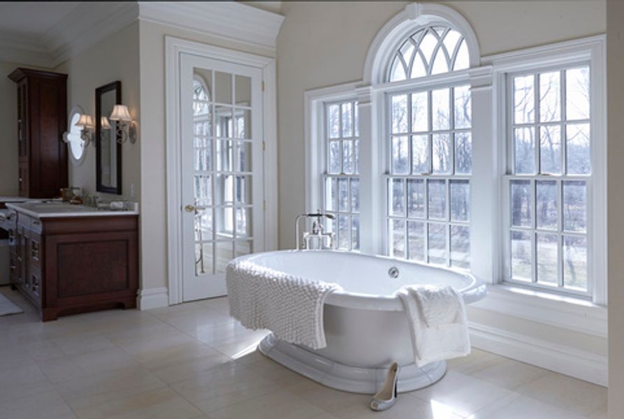 There is a bathtub in the middle of the bathroom