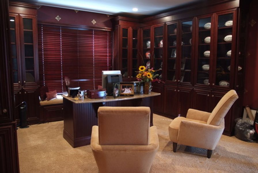 A home office with two chairs and a desk