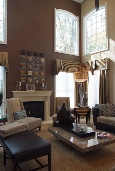 A living room with lots of furniture and a fireplace