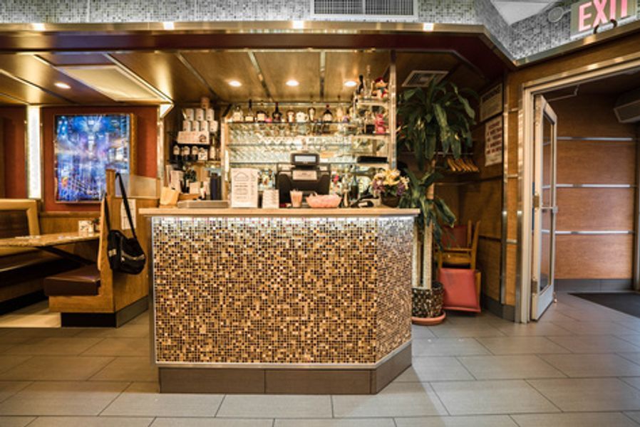 A restaurant with a bar and a sign that says exit