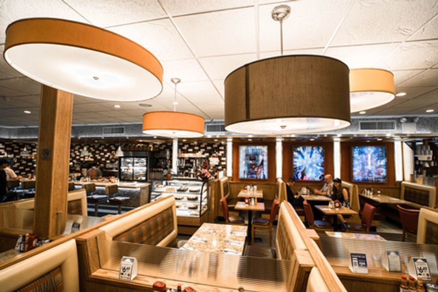 A diner with a lot of tables and chairs