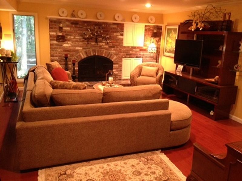 A living room filled with furniture and a fireplace