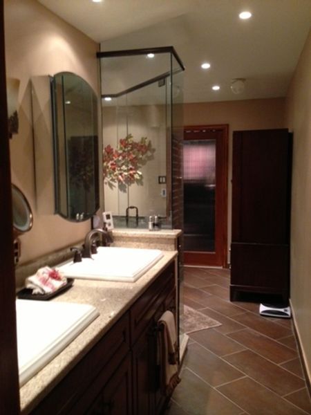 A bathroom with two sinks and a mirror