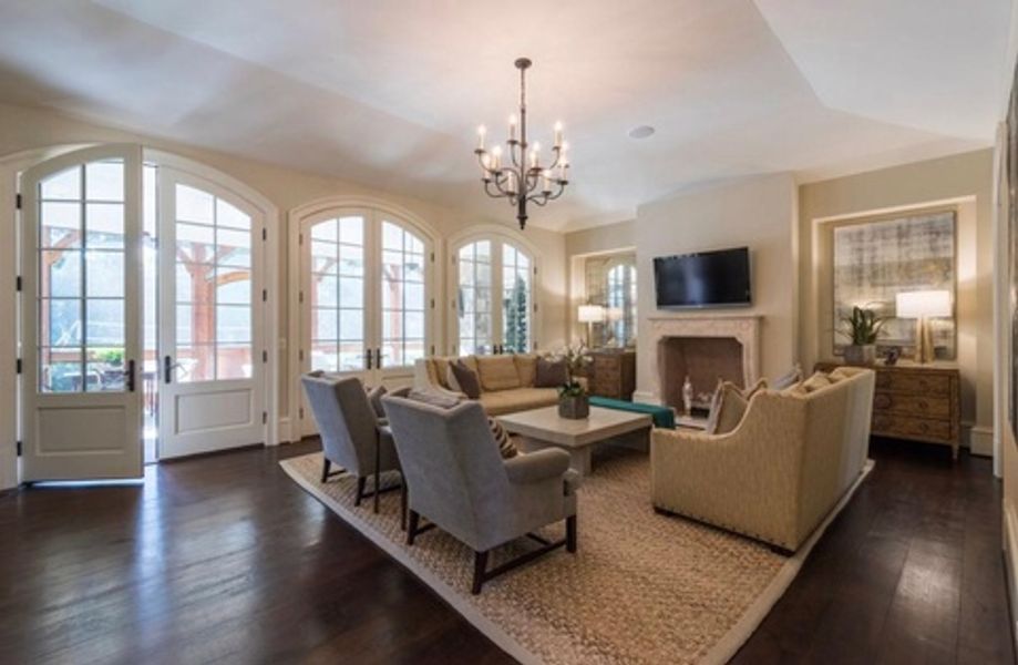 A living room filled with furniture and a fireplace