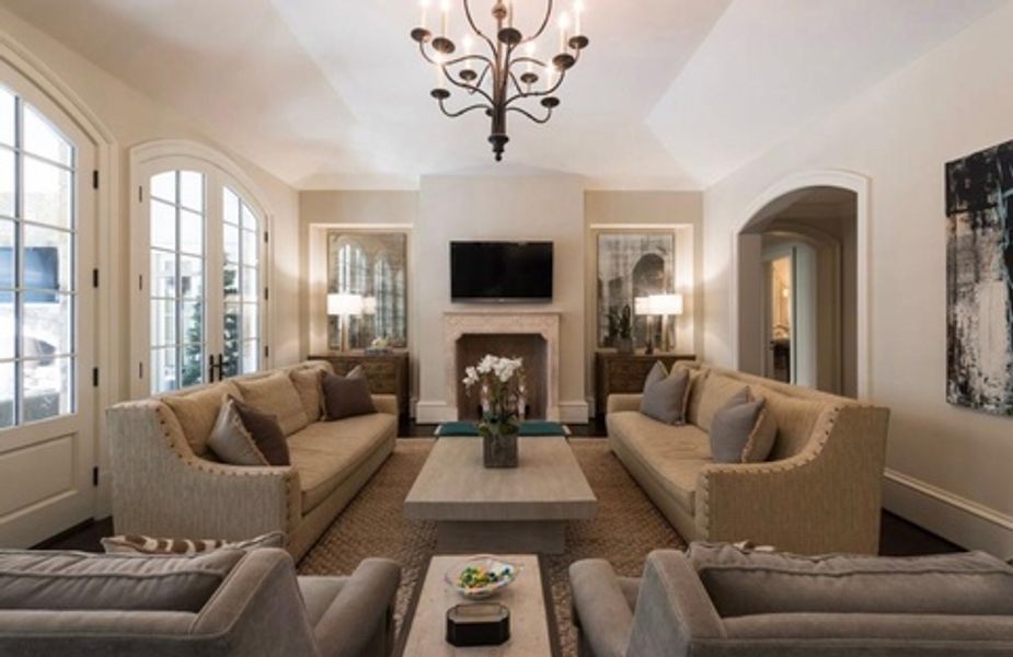 A living room filled with furniture and a fireplace