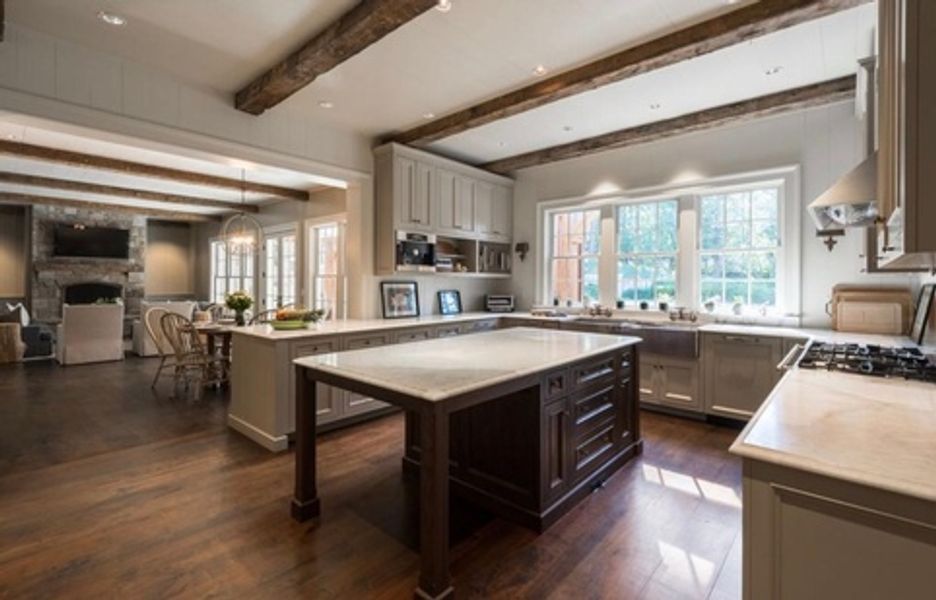 There is a large island in the middle of the kitchen