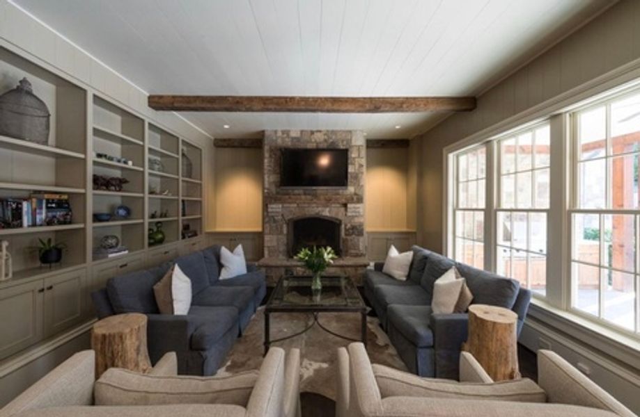 A living room filled with furniture and a fireplace