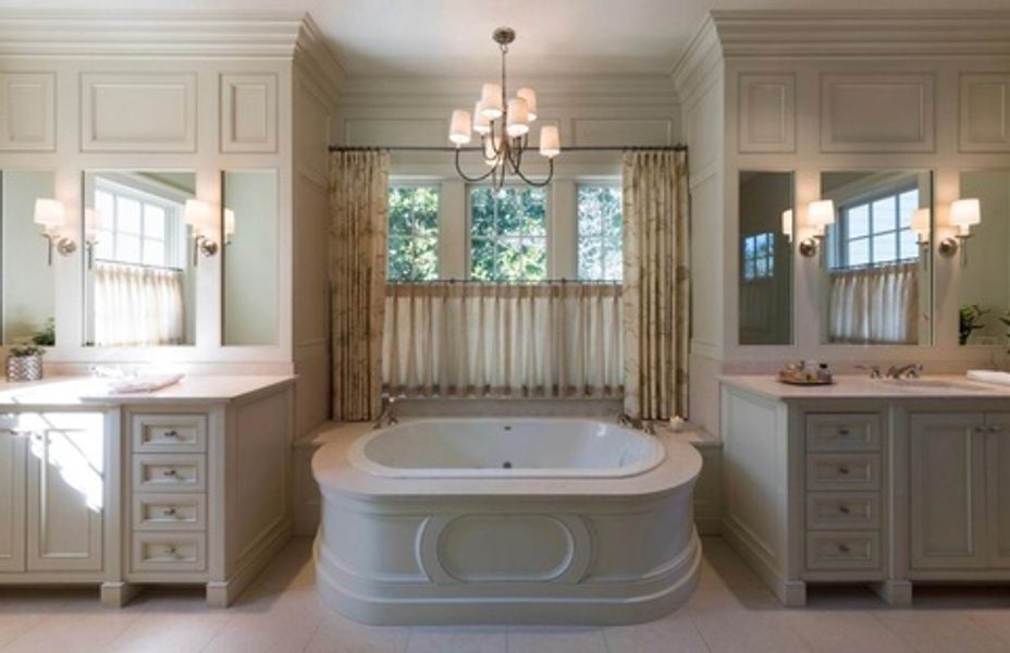 A bathroom with two sinks and a bathtub