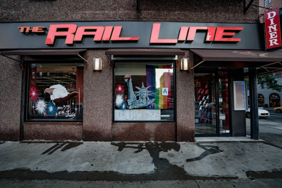 The front of a store called the rail line