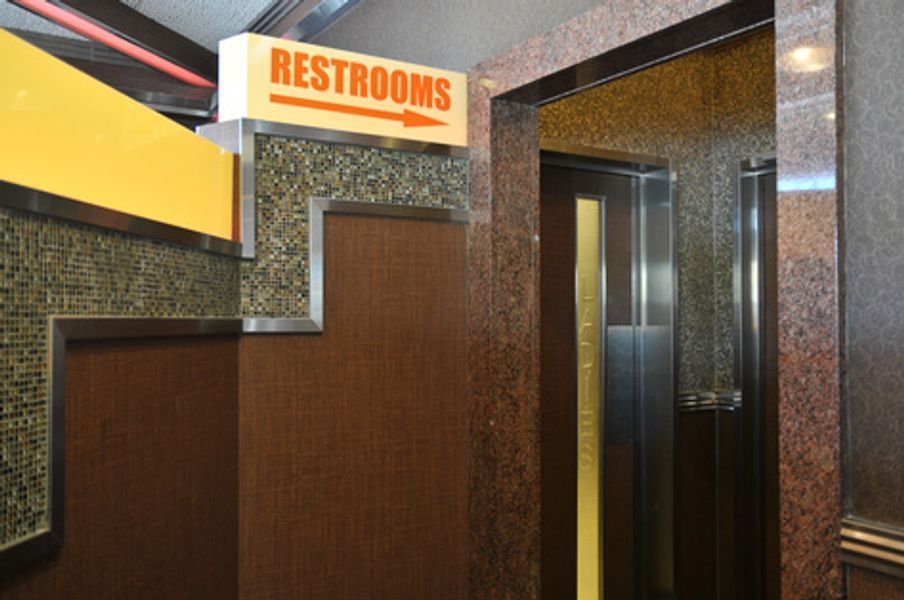 A room with a sign that says restrooms on it