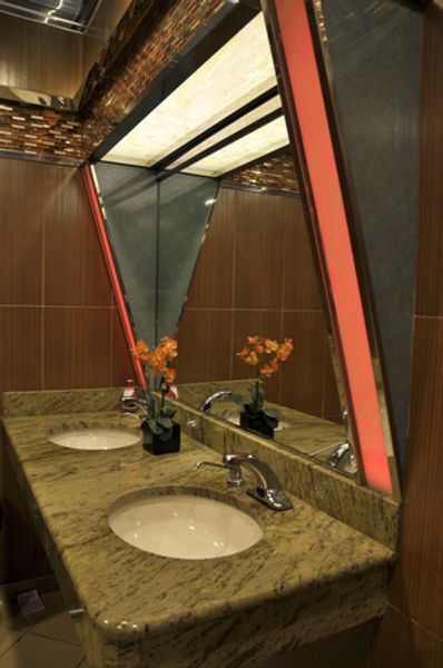 A bathroom with two sinks and a mirror