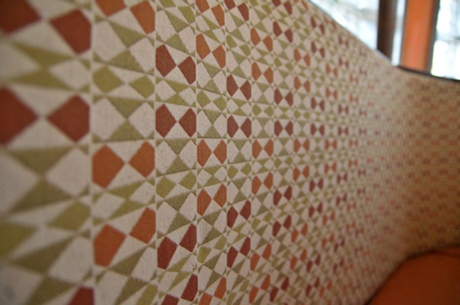 A close up of a wall with a geometric pattern on it