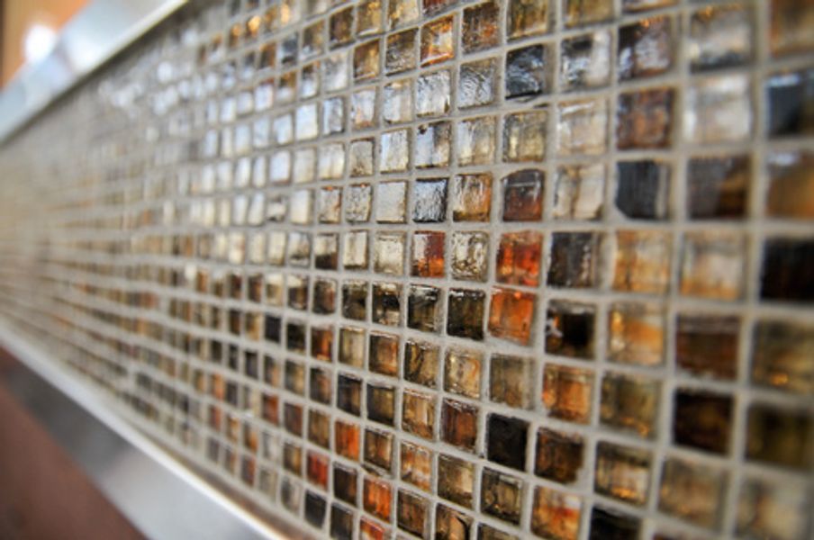 A close up of a tiled wall with a lot of squares on it