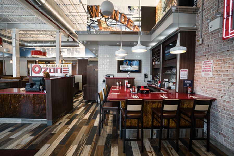 A restaurant with a sign that says ozone on it