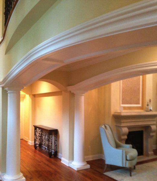 A living room with a fireplace and a chair