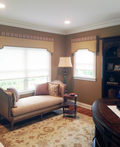 A living room with a couch and a lamp