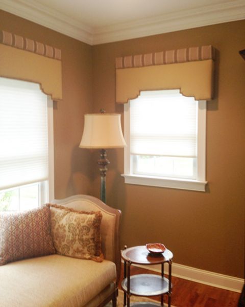 A living room with a couch and a lamp