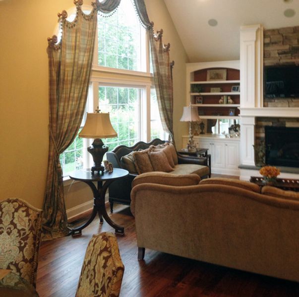 A living room filled with furniture and a fireplace
