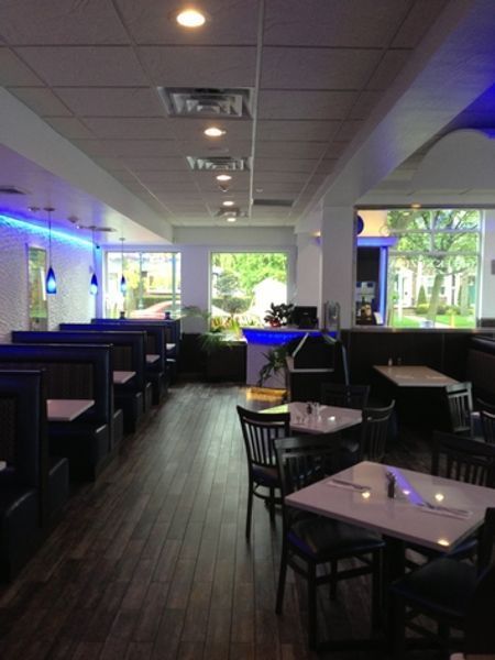 A restaurant with a lot of tables and chairs