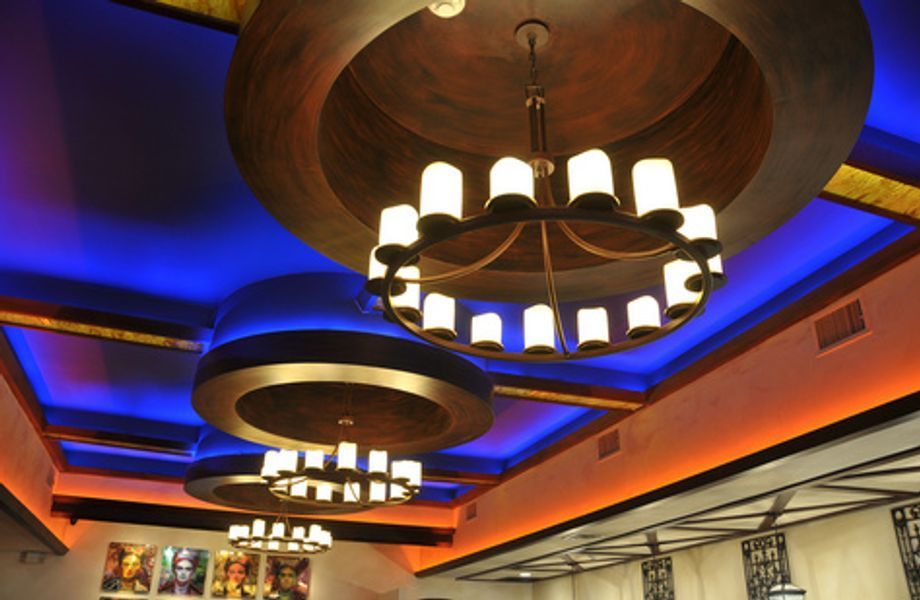 A room with a lot of lights hanging from the ceiling