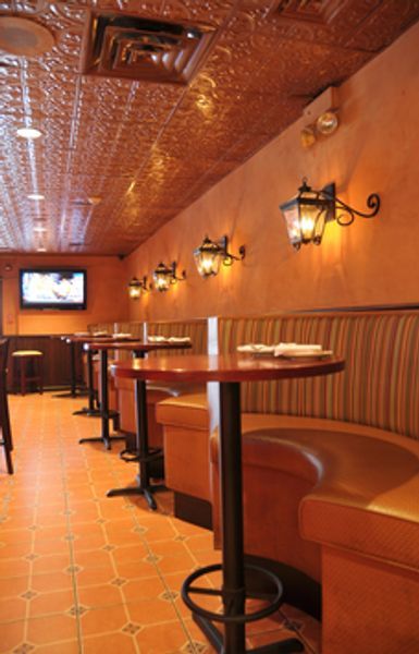 A row of booths and tables in a restaurant
